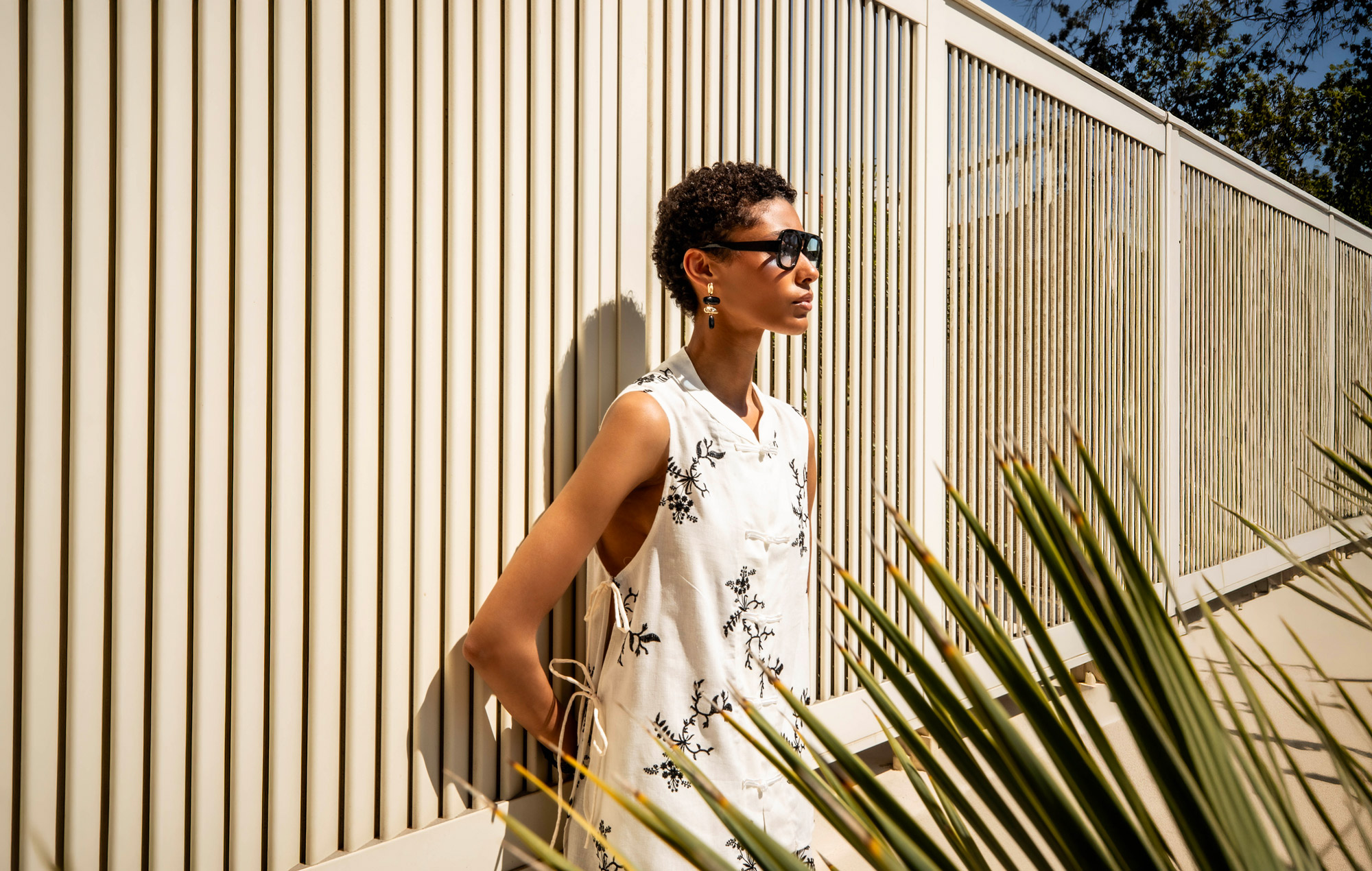 MIHO’S embroidered summer top styled in warm architectural light